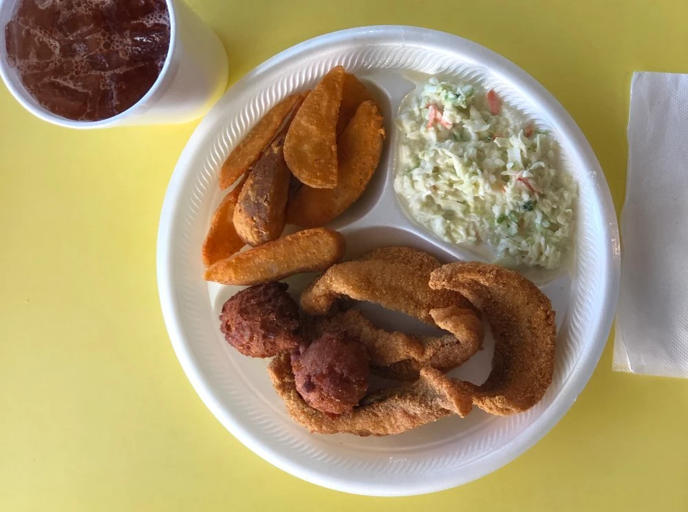 Fried fish with potato logs, cole slaw, and sweet tea at Chicken Country