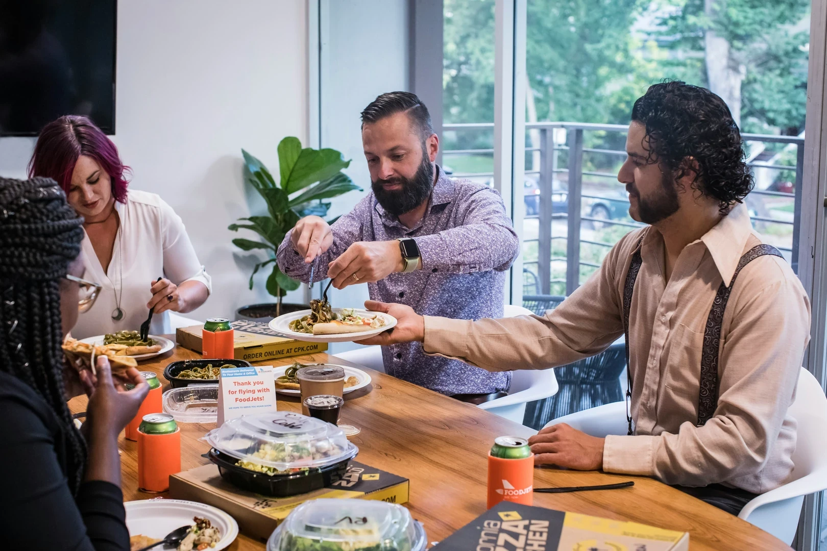 Colleagues seated around a table at a working lunch