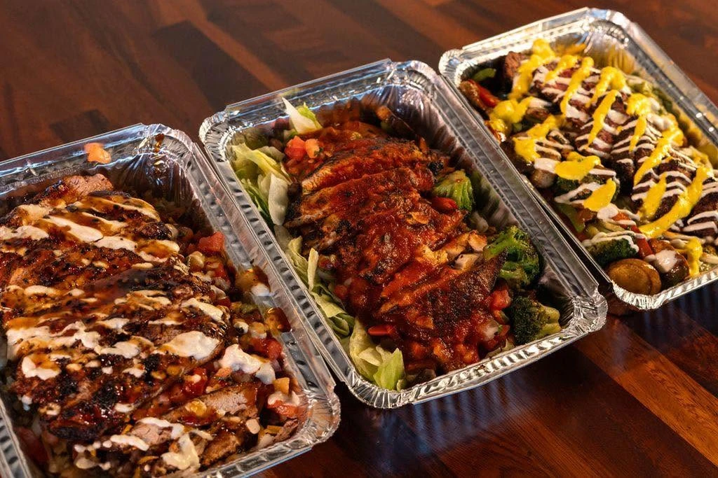 Catering trays of chicken and plantains