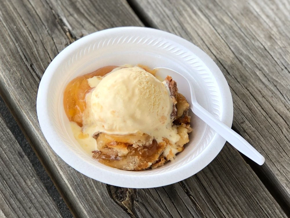Peach cobbler topped with vanilla ice cream at Chicken Country
