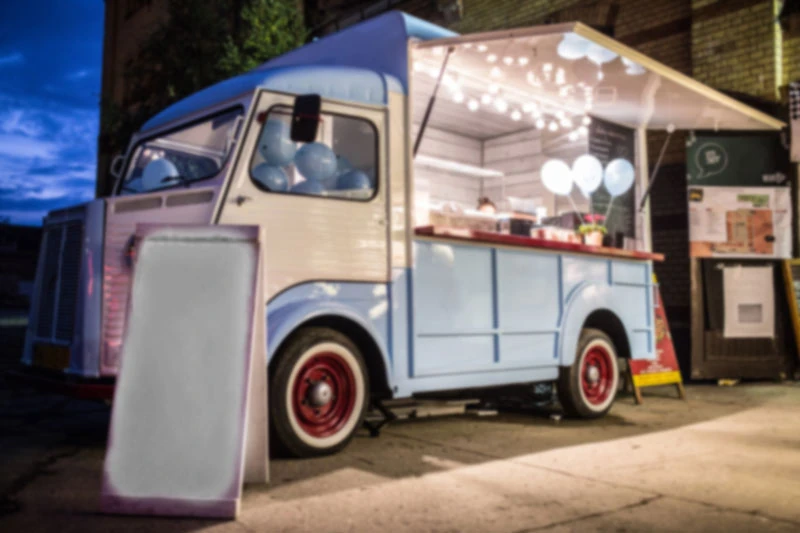 A food truck serving guests at an evening event
