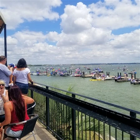 Waterfront patio view with boats on the lake near Primo's Tex Mex Grille