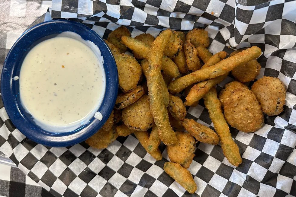 Fried appetizer with a side of sauce
