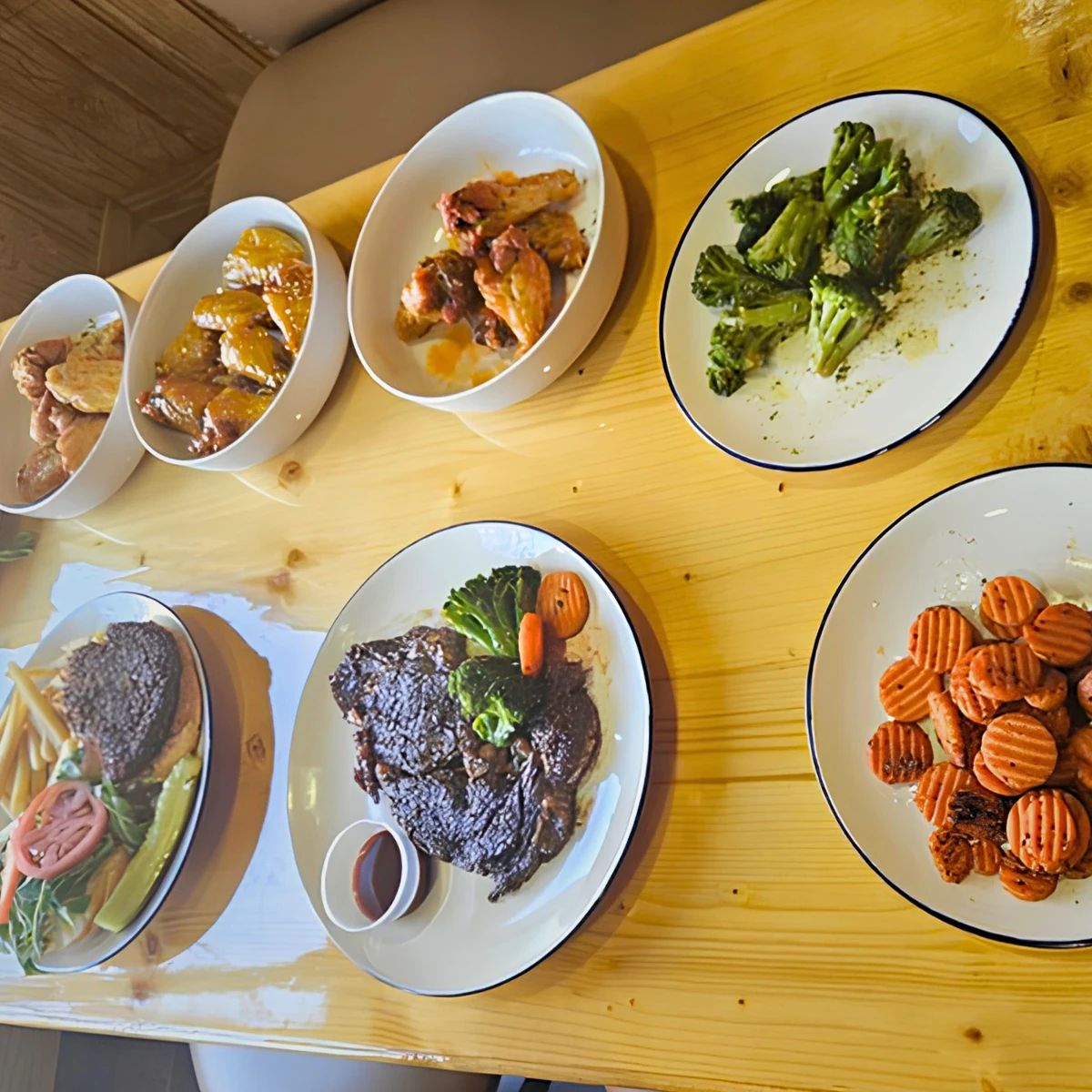 Steak, chicken wings, broccoli and carrots at The Copper Table