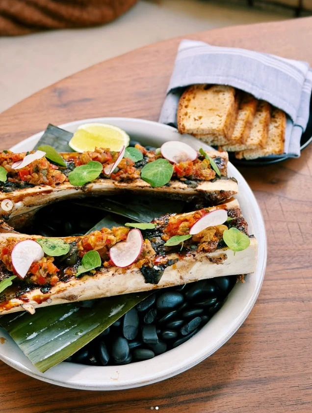 Wood-fired bone marrow with salsa and grilled bread at Nomade Cocina