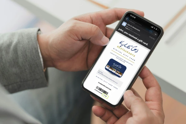 A digital Kyle G's gift card on a phone