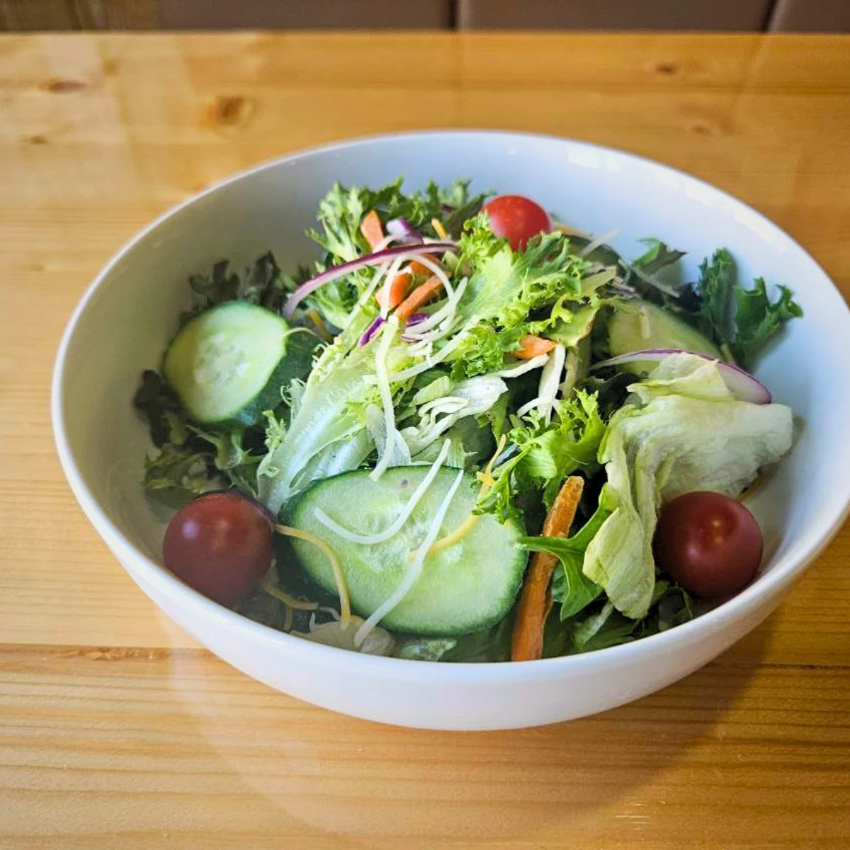 Fresh garden salad with cucumbers and tomatoes at The Copper Table