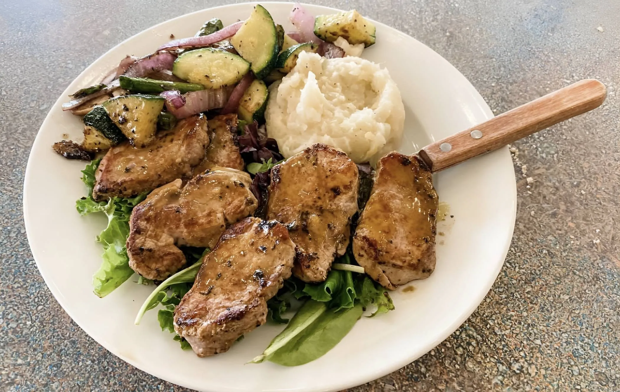 Plowman's Restaurant pork medallions dinner plate with vegetables