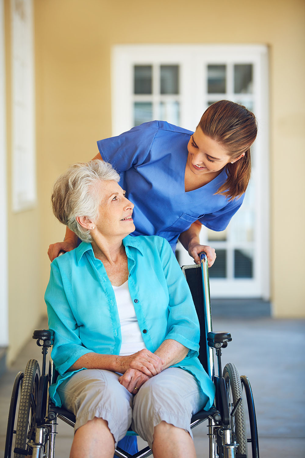 nurse taking blood pressure of patient