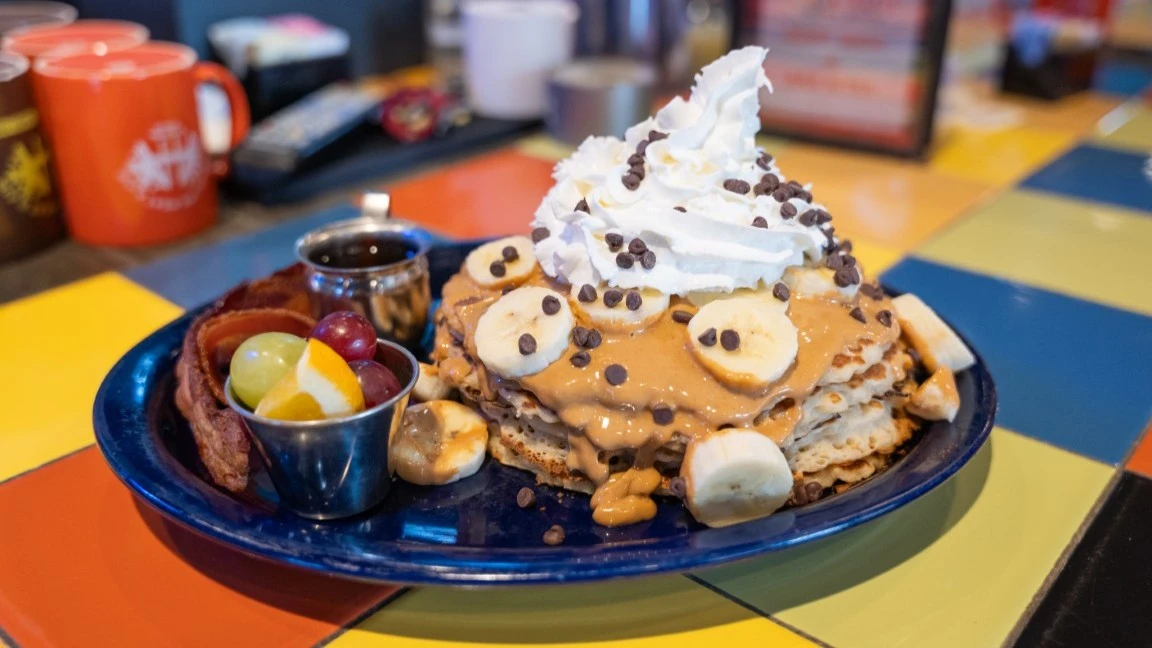 pancakes with whipped cream and bananas