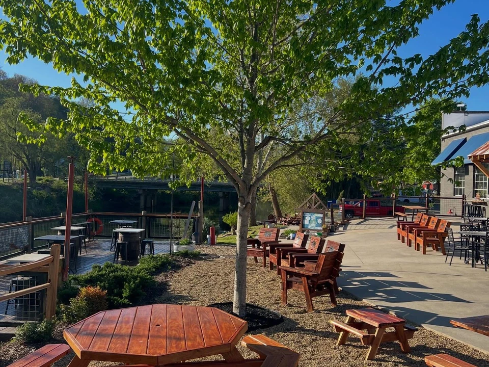 Outdoor seating, shops, and trees in downtown Canton, North Carolina