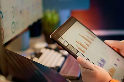 Person reviewing performance data on a tablet