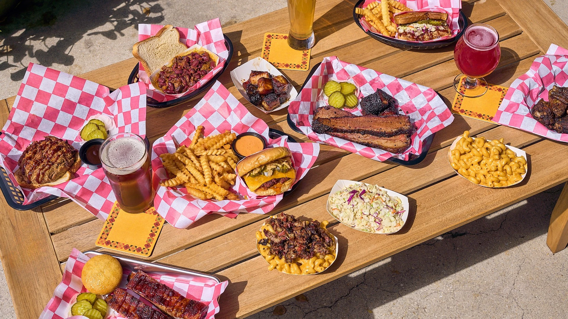 a table filled with bbq dishes from Captains BBQ