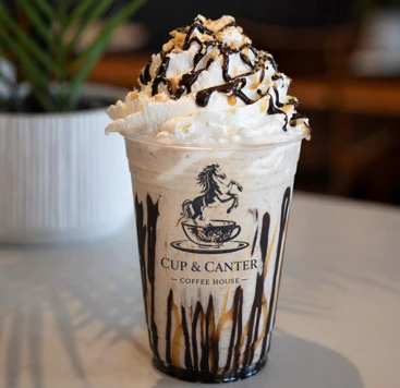 Cup and Canter frappe with whipped cream and chocolate drizzle