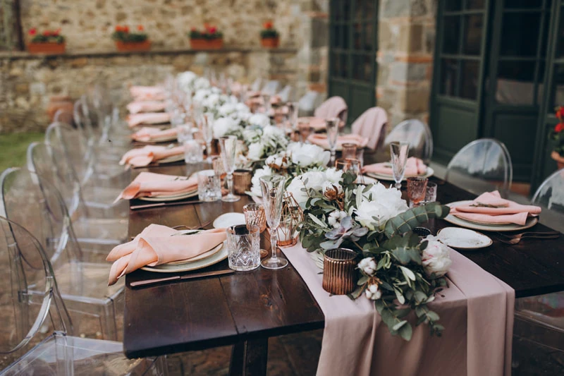 A pastel dinner placement awaiting guests
