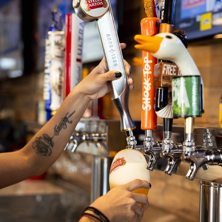 Bartender pouring a draft beer