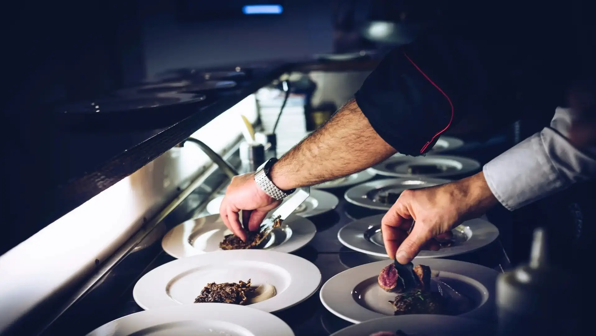 people prepping food in a kitchen