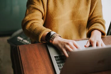 Person using a laptop at a desk