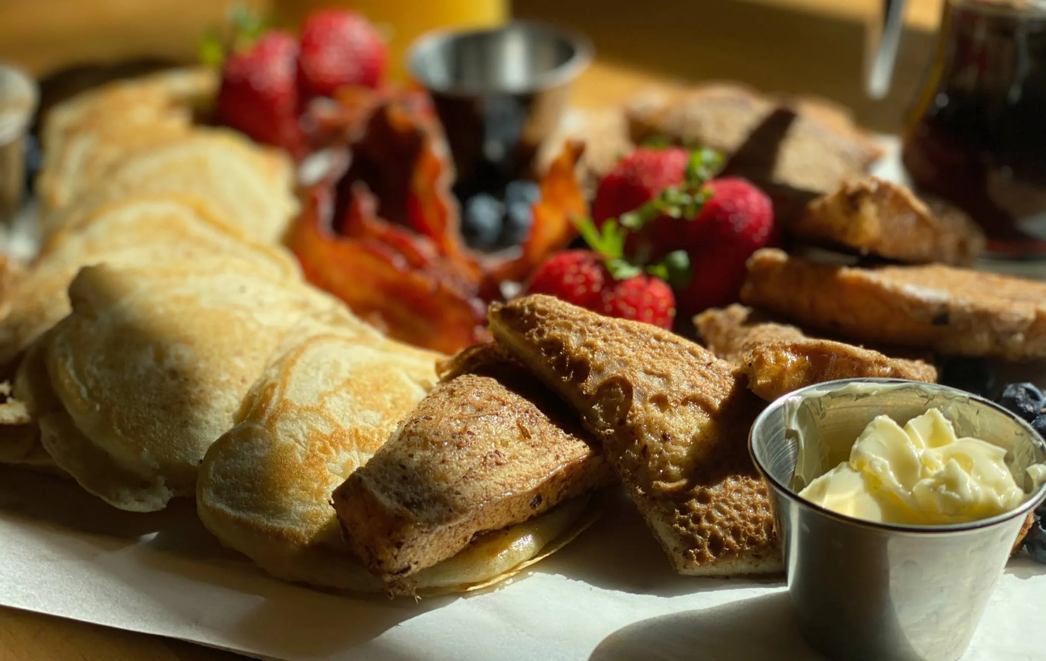 Plowman's Restaurant breakfast platter with pancakes and berries