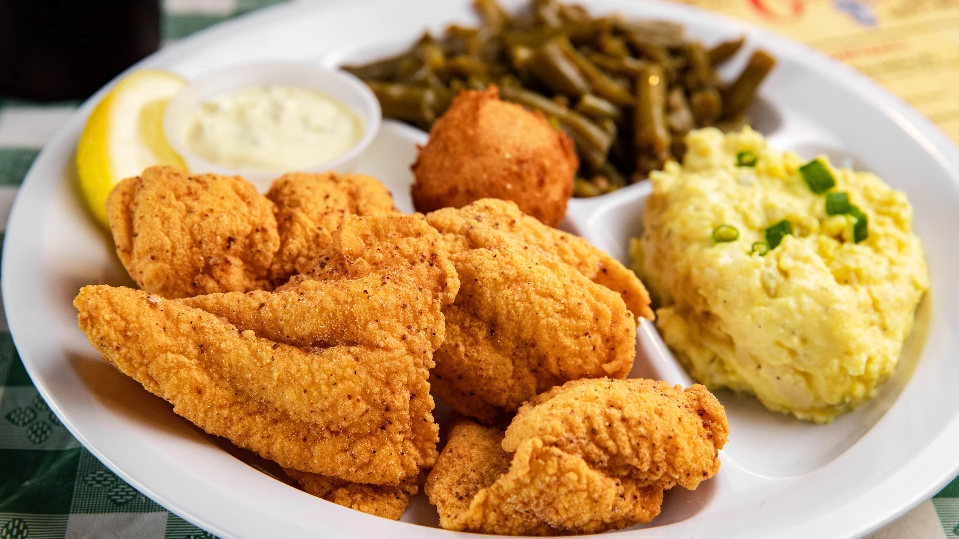 Plate of fried food with two side dishes