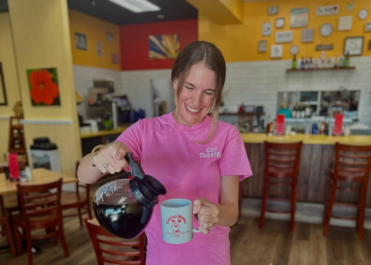 someone pouring a cup of coffee