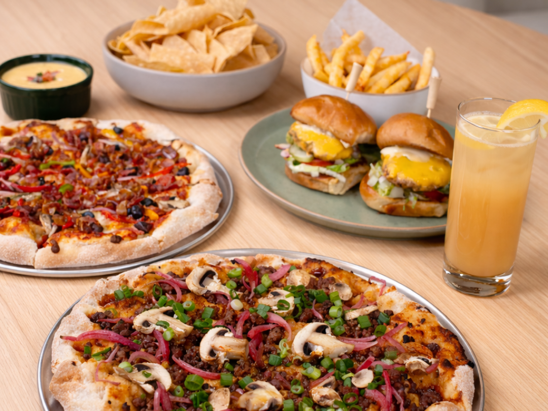 Pizza, sliders, chips, and french fries with a drink from Always Sunny Golf