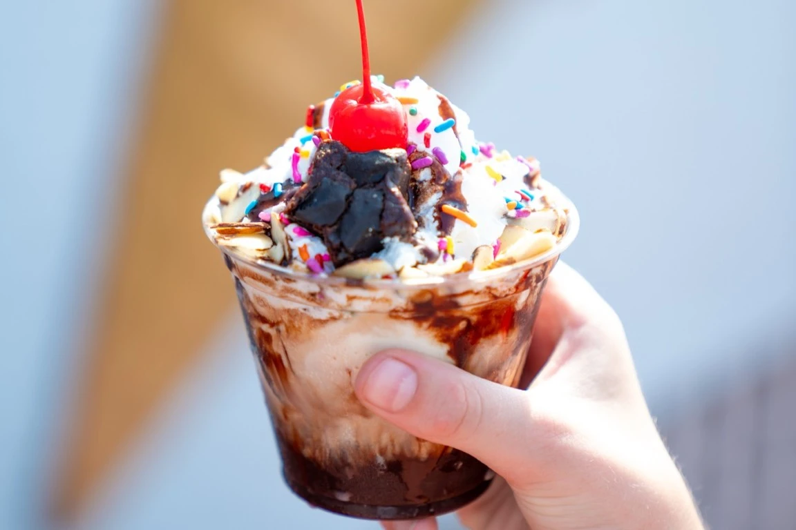 Ice cream sundae in a cup with a cherry on top
