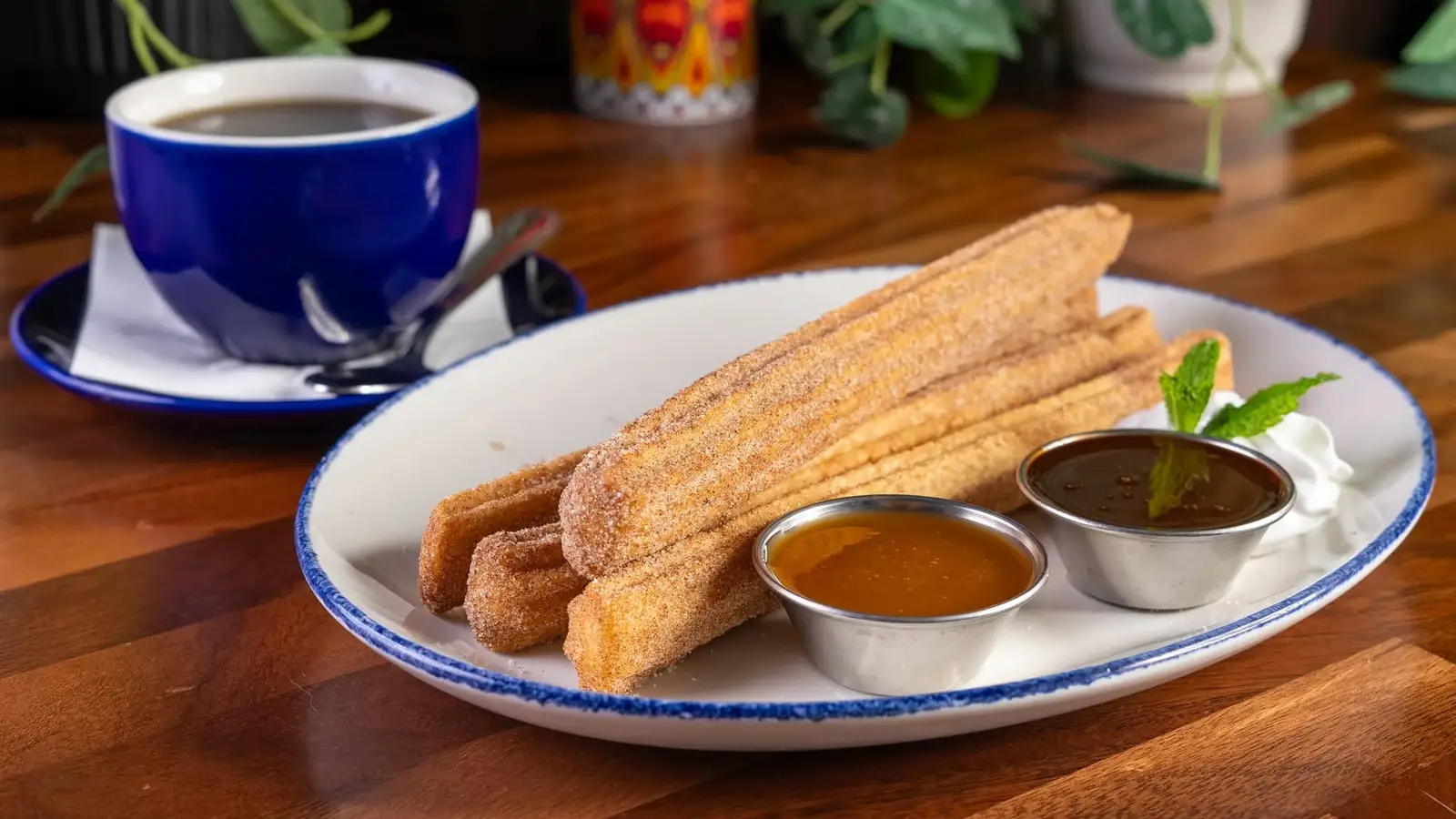 Churros with dipping sauces and coffee