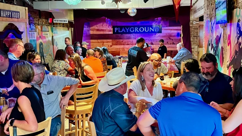 A full dining room at PLAYGROUND BURGER BAR