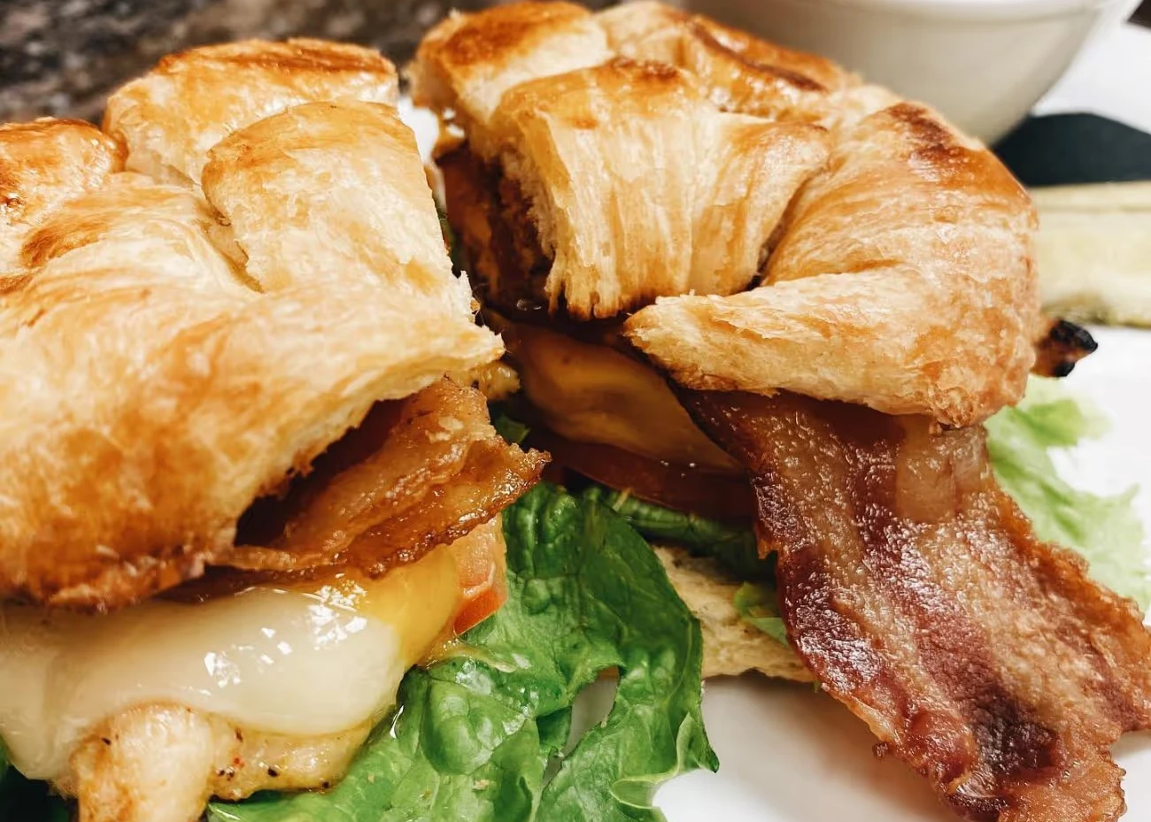 Breakfast croissant sandwich with bacon