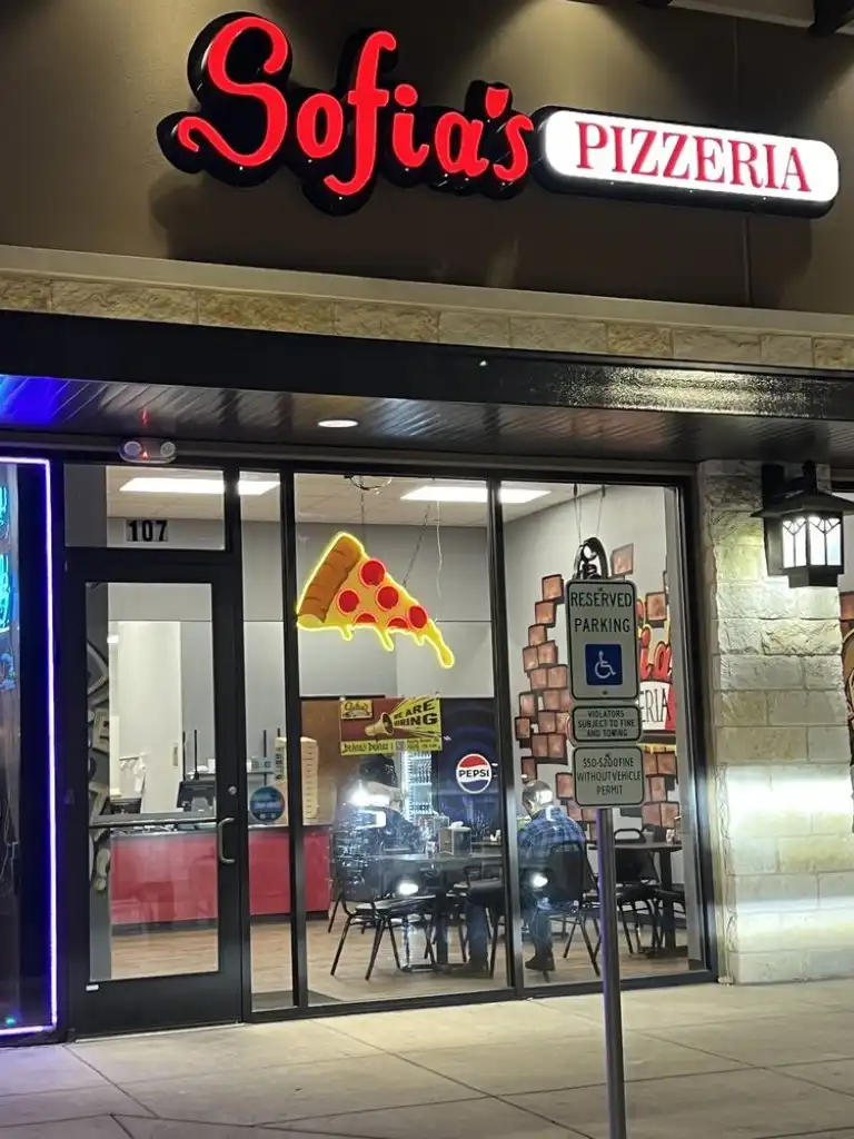 Sofia's Pizzeria Evans storefront at night