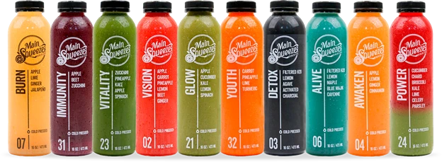 Full lineup of Main Squeeze juice bottles with various flavors and vibrant colors
