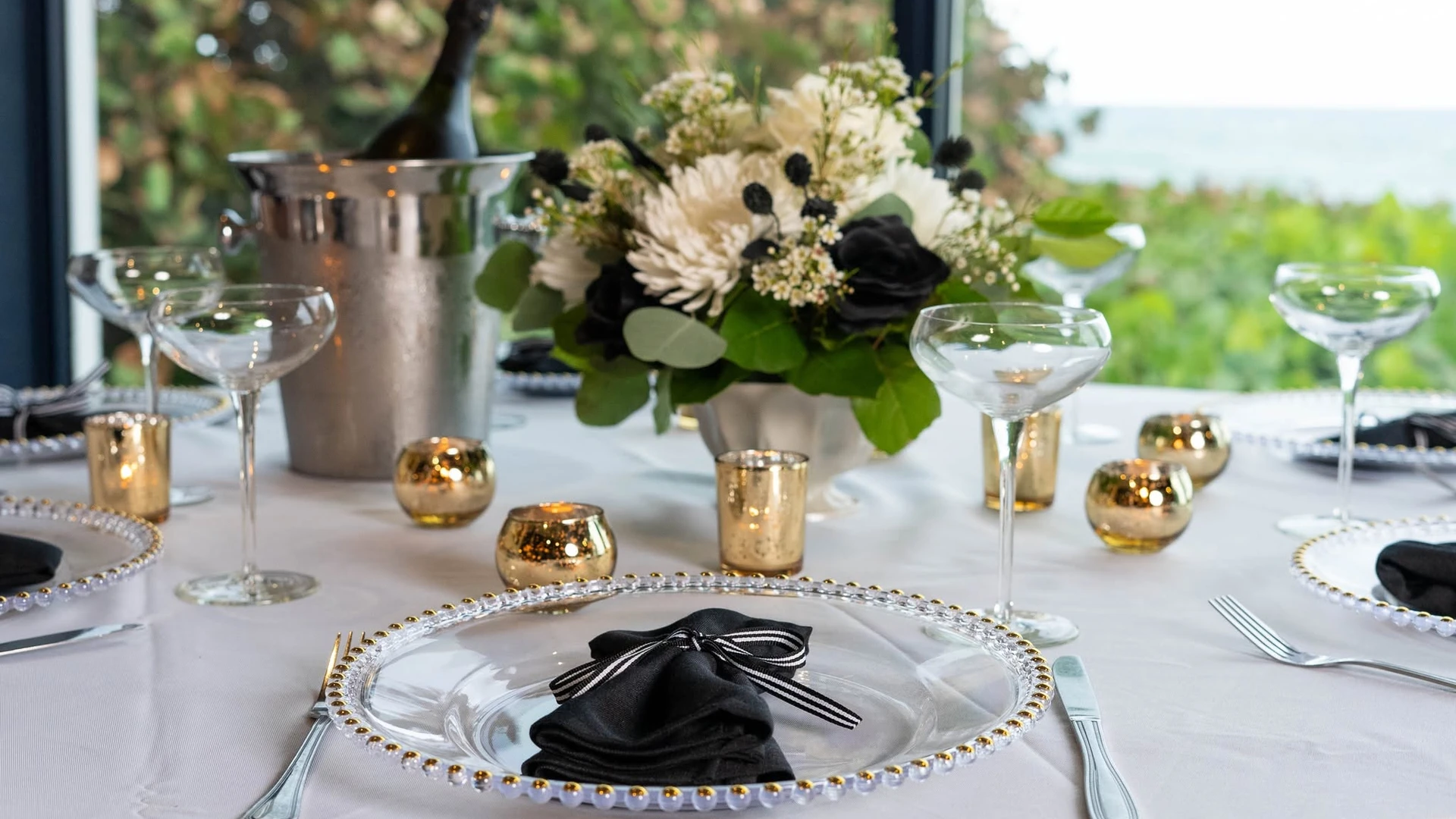 Celebration table set with florals and champagne