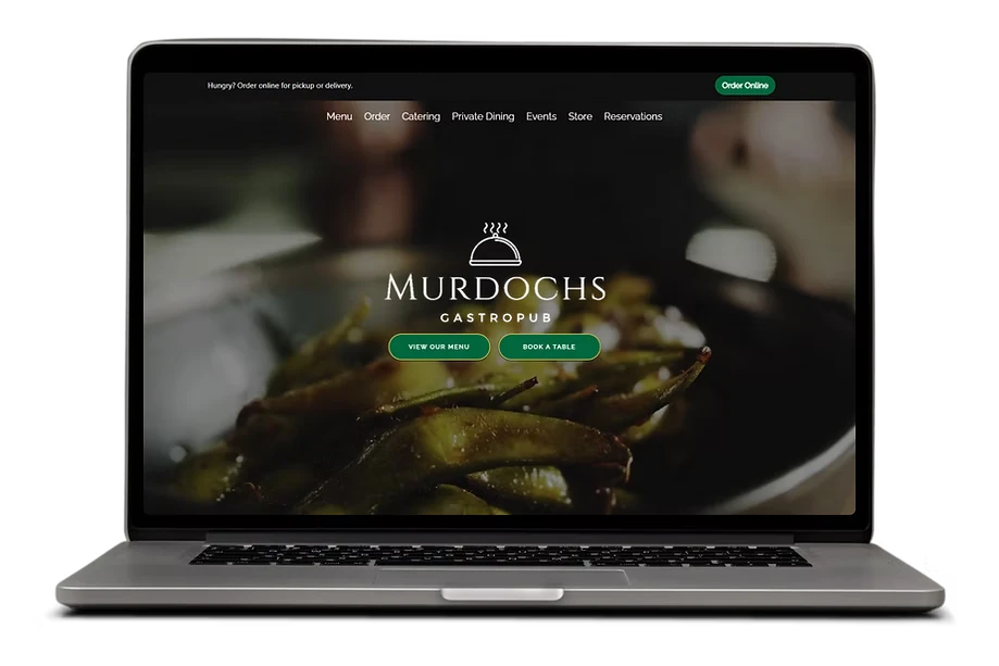 murdochs irish pub example site on a laptop
