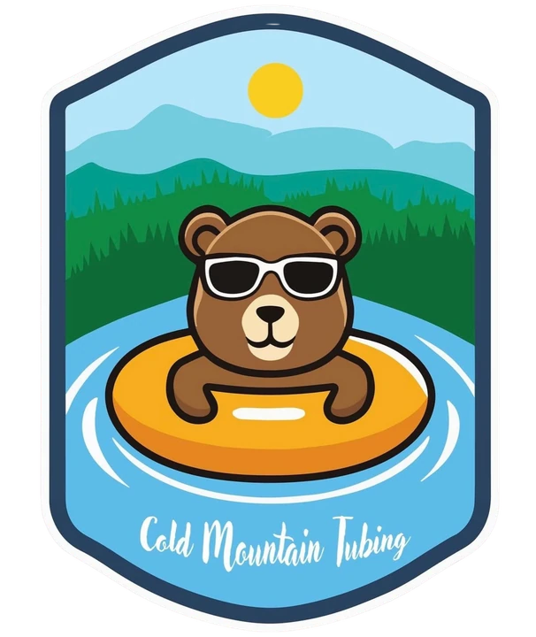 Cold Mountain Tubing logo featuring a bear floating in an inner tube on a mountain river