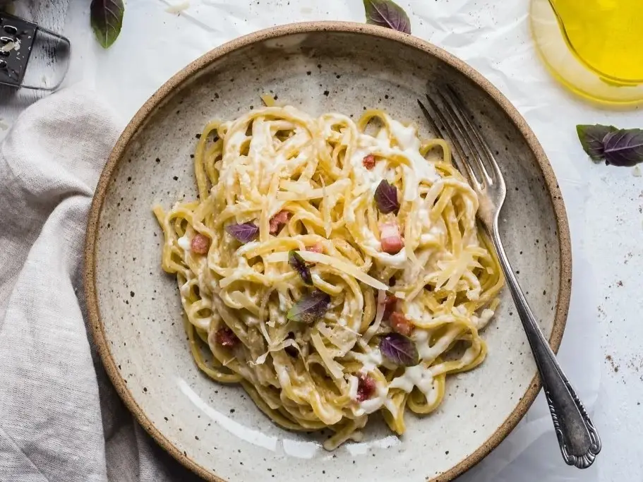 Pasta on a plate with a fork