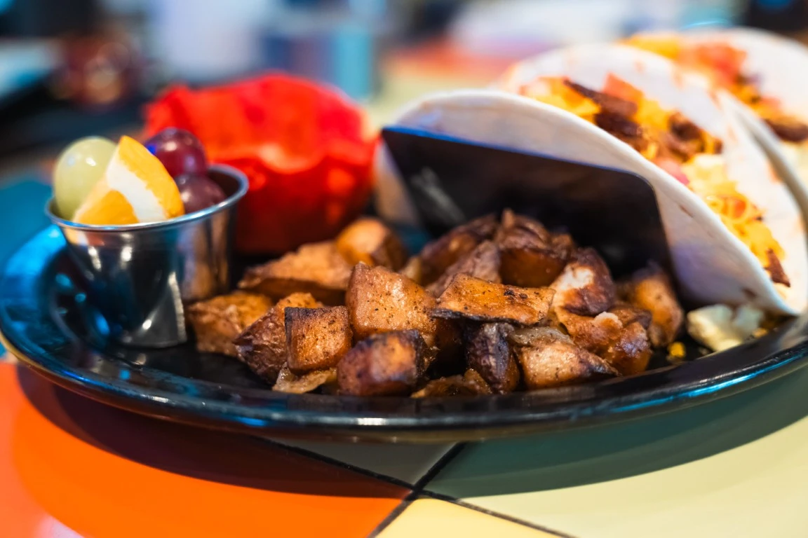 Tacos with side of potatoes