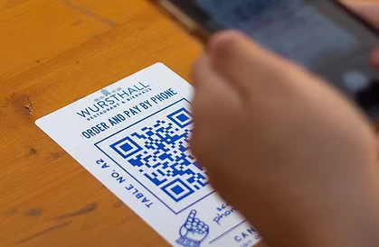 Person scanning a QR code