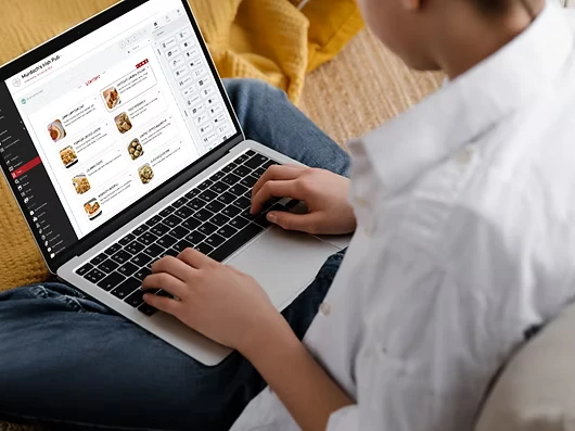 Someone looking at a restaurant on the laptop