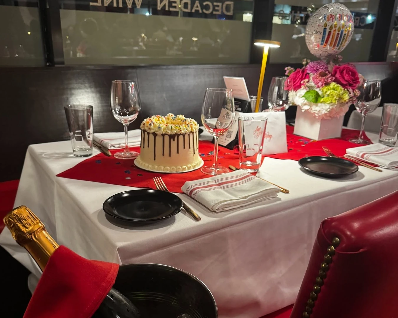 Celebration table with cake and florals