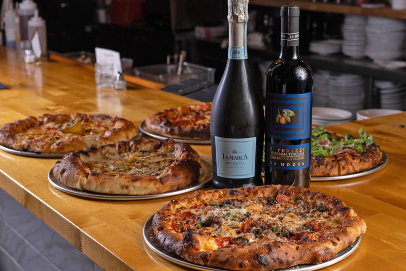 Pizzas and wine for a catered party
