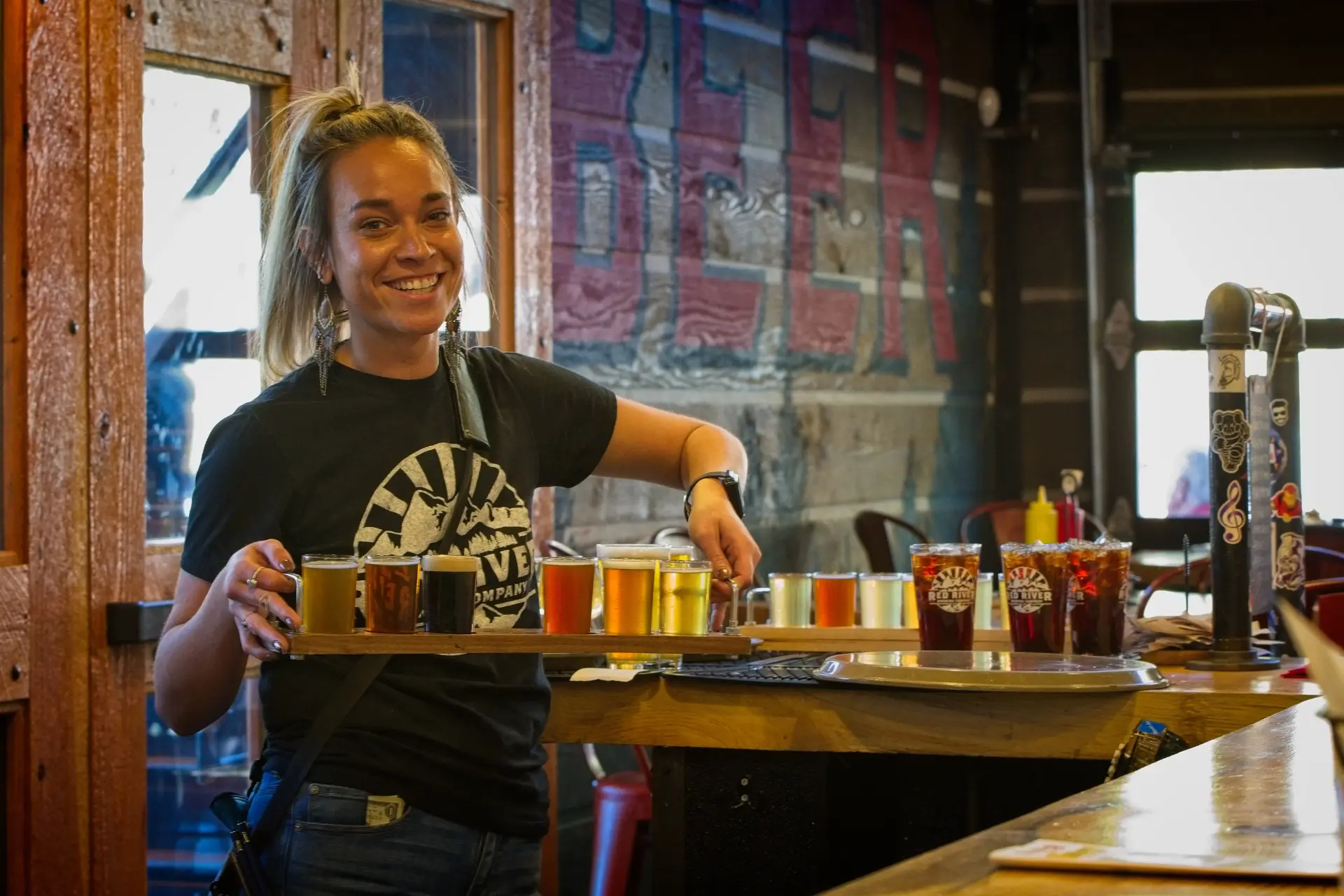 Bartender holding beer array