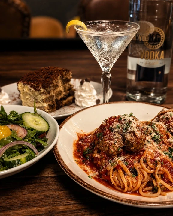 Spaghetti and meatballs with a martini