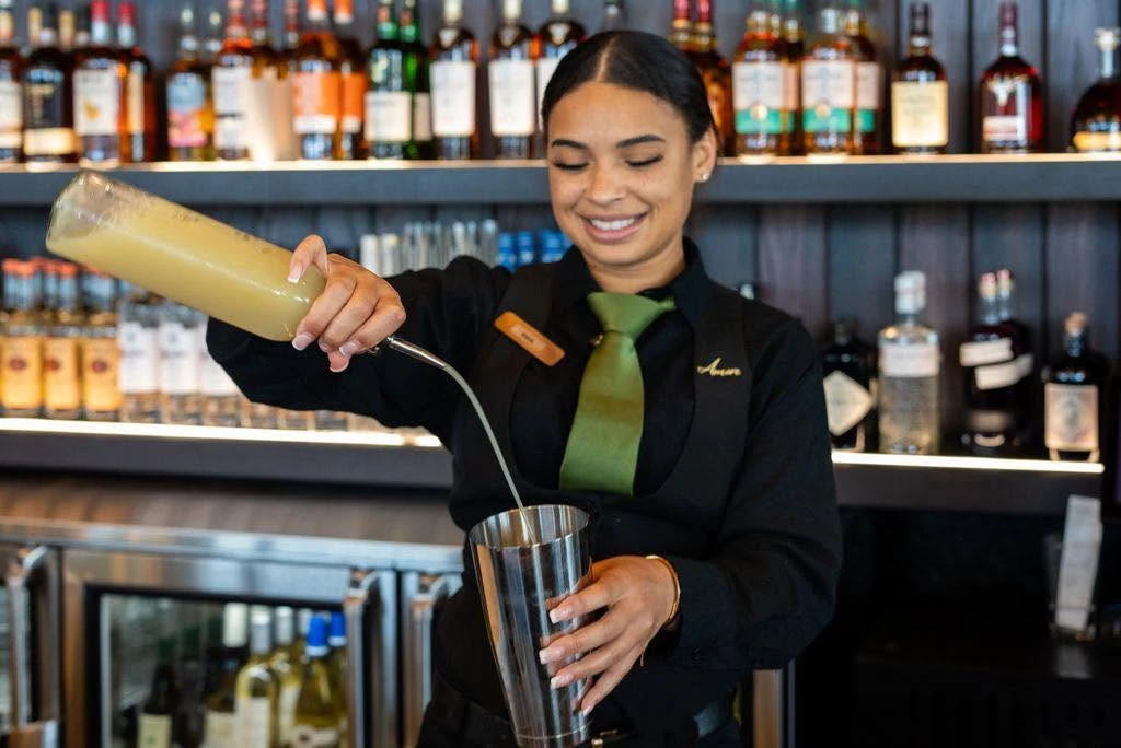 Bartender pouring a cocktail