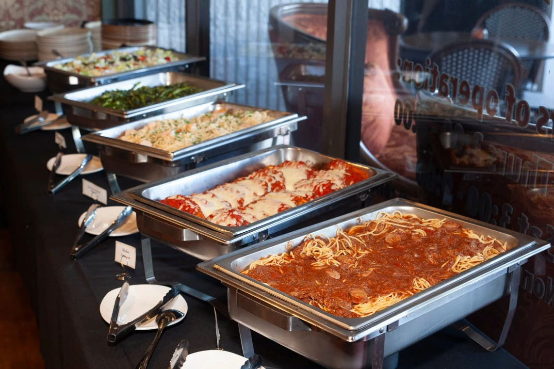 Catering trays of lasagna and pasta