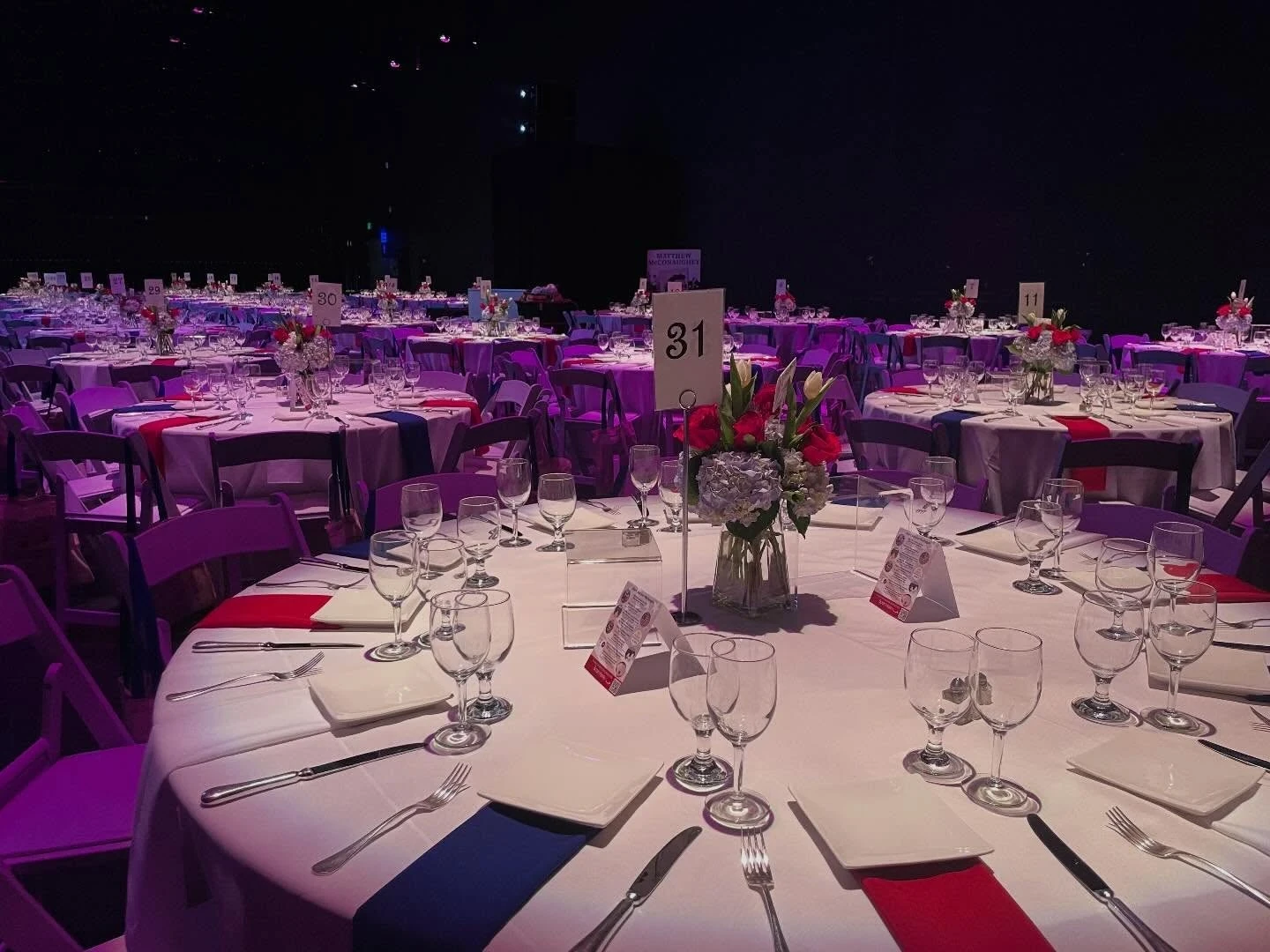 Event space lit with colored uplighting