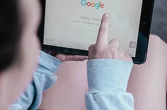 Someone searching google on their tablet