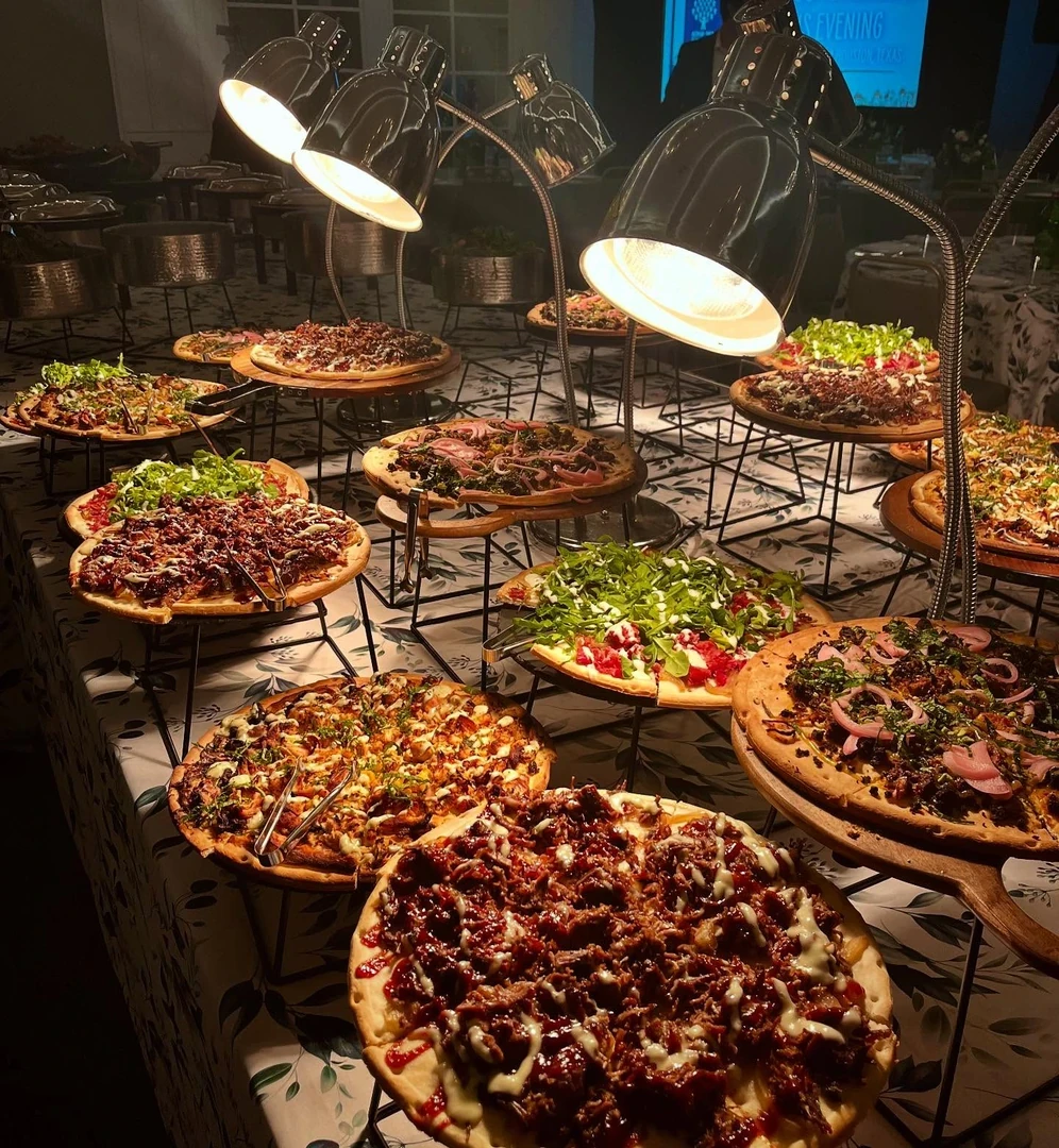 Chefs plating food at a catered event
